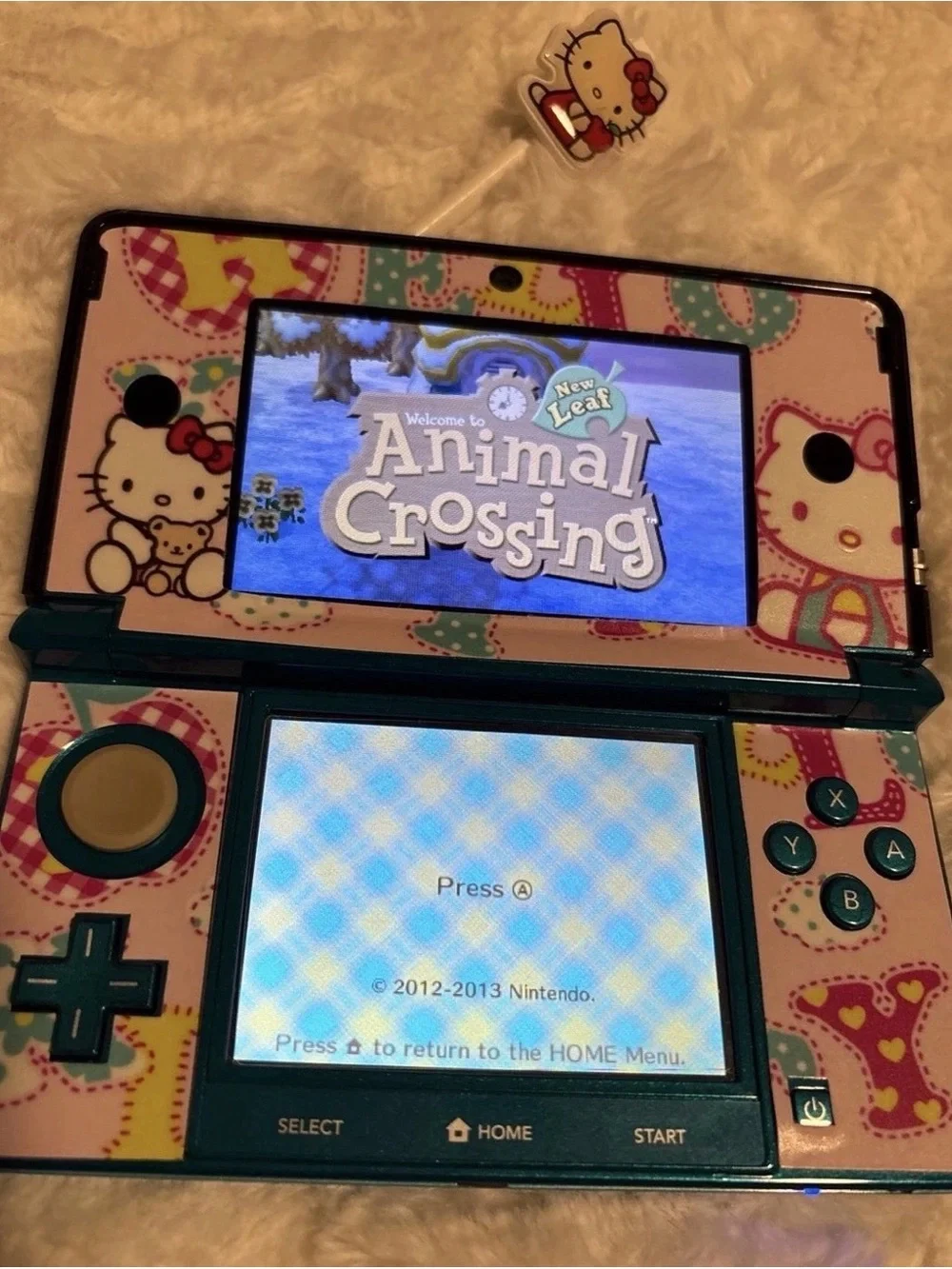 Nintendo Hello Kitty DS Bundle with Blue Handheld & Red-Accented Case